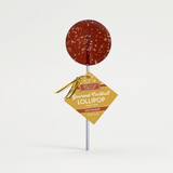 Old Fashioned Bourbon Lollipops on neutral studio background