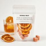 Old Fashioned Cocktail Kit with cocktail, dried orange wheels, and bitters cubes