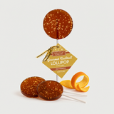 Old Fashioned Bourbon Lollipops with loose lollipops and orange twist