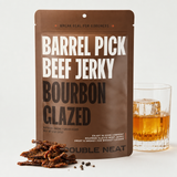 Bourbon Glazed Beef Jerky with neat bourbon and jerky pieces