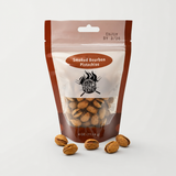 Smoked Bourbon Pistachios on neutral studio background