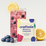 Bourbon Blueberry Lemonade mix with prepared drink, blueberries, and lemon