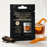 Smoked Old Fashioned mix with smoking cocktail, oak chip, and orange peel