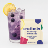 Bourbon Blueberry Lemonade mix with prepared drink on neutral studio background