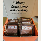 Open orange Double Neat gift box packed with twelve individually wrapped Bourbon Brownies