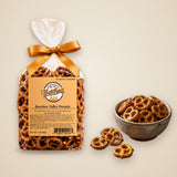 3 oz bag of Thatcher's Bourbon Toffee Pretzels next to a bowl of pretzels